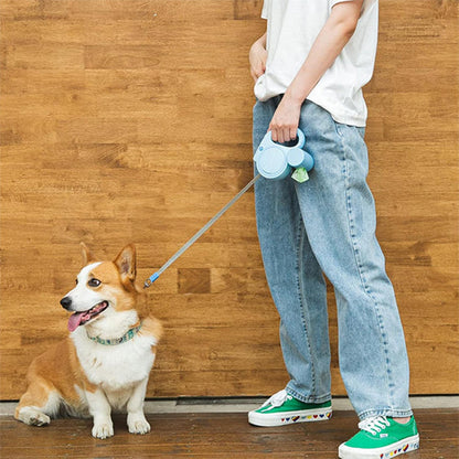 chien assis avec laisse pour chien enrouleur